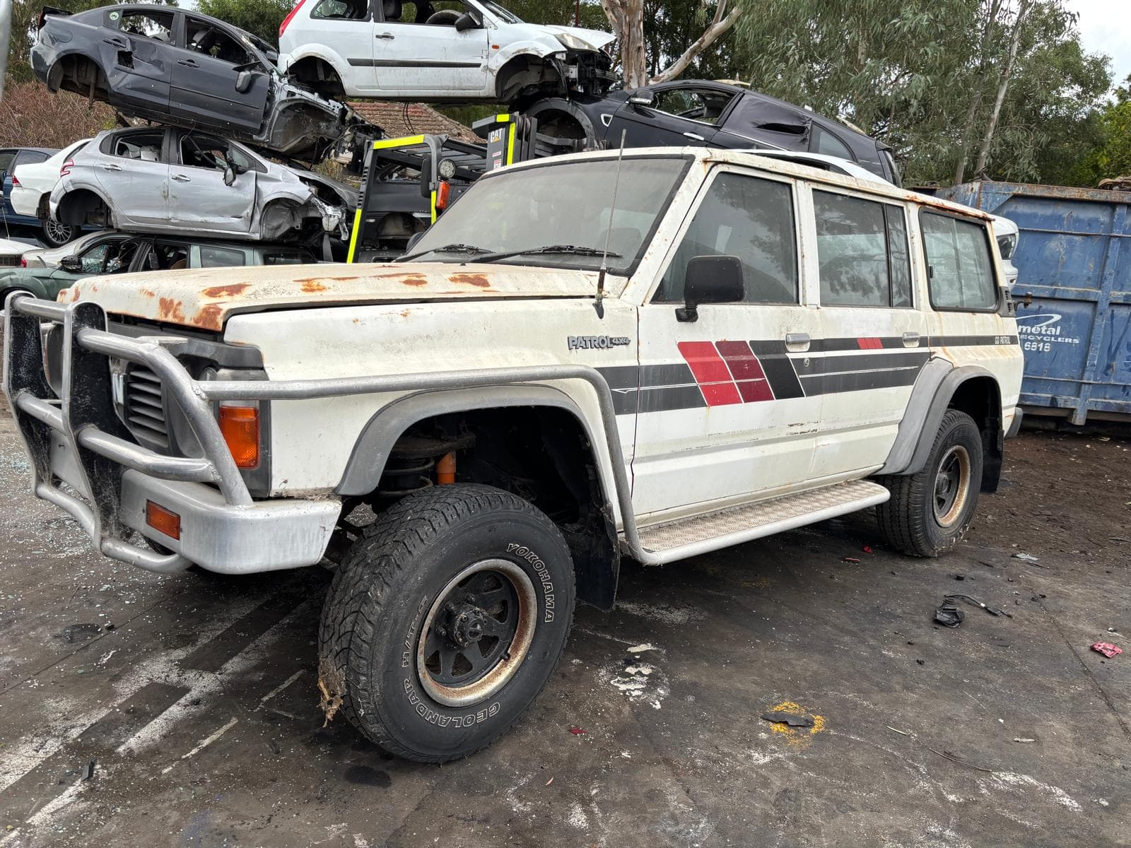 Crash-damaged cars stored at the iCar Removals yard in Perth awaiting dismantling and recycling